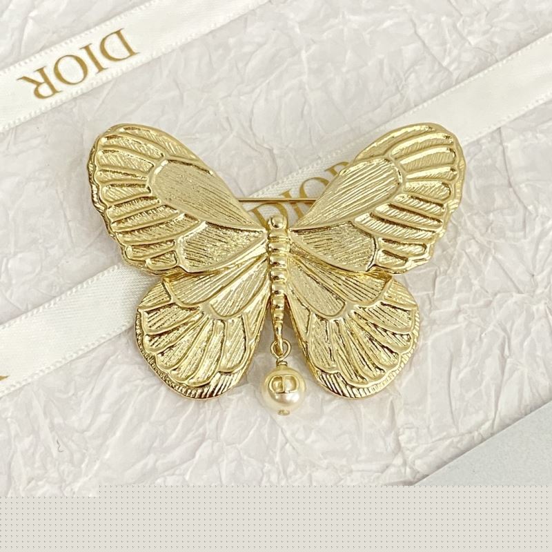 ch**an D*or brooches